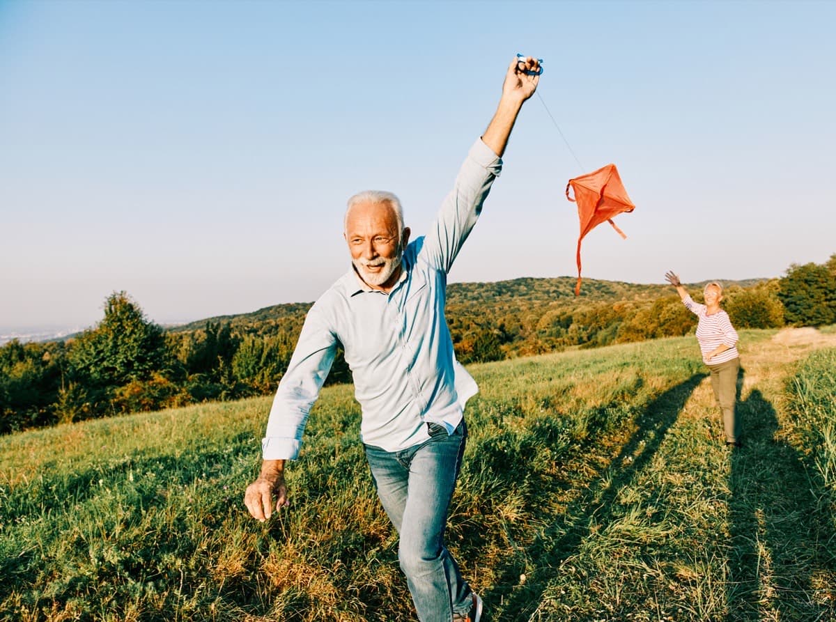 Active older couple enjoying movement outdoors